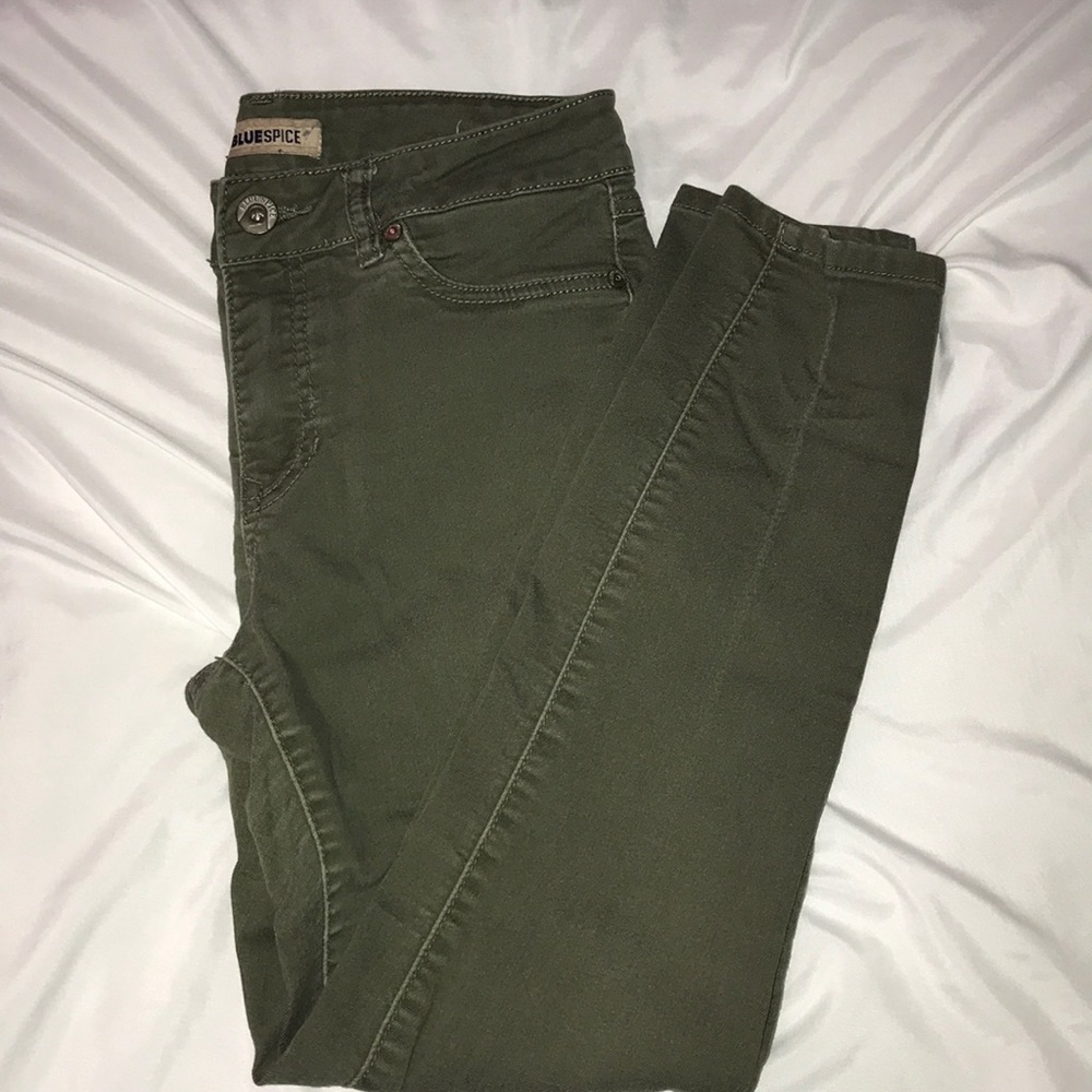 A pair of army colored skinny jeans